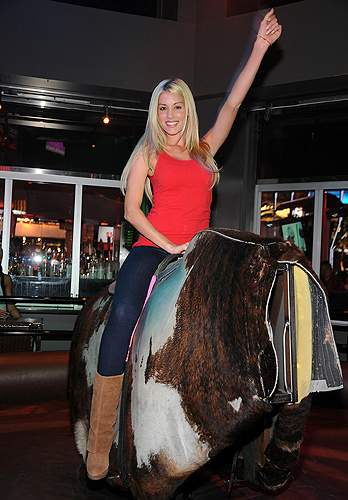 Heather_Rae_Young_rides_the_mechanical_bull_at_PBR_Rock_Bar