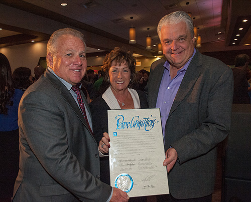 Greg Rochna Brenda Rochna and Steve Sisolak with the Maverick Helicopters Day proclamation