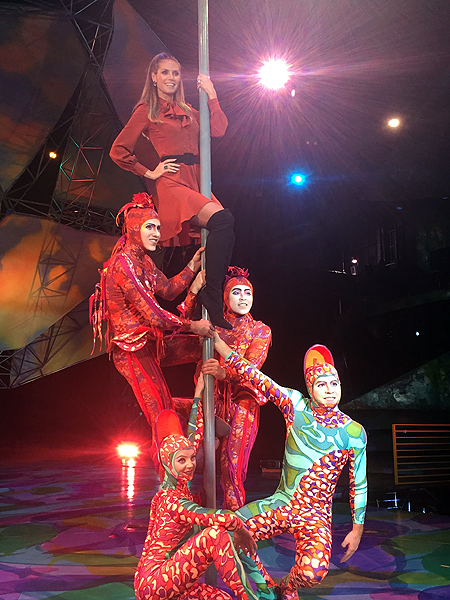 Heidi Klum tries her hand at climbing the iconic Chinese Poles featured in Mystere