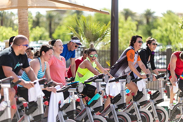 Group of cyclists burning calories for a cause