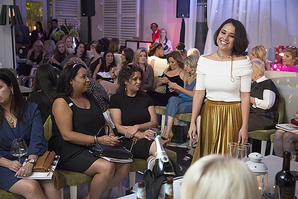 Model walking the runway wearing fall fashions by Dillard s Credit Lucinda Flint Photography