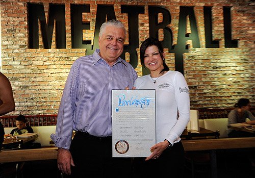Steve Sisolak presenting Carla Pellegrino with proclamation