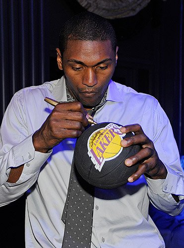 Metta_World_Peace_autographs_basketball_at_Chateau_Nightclub__Gardens