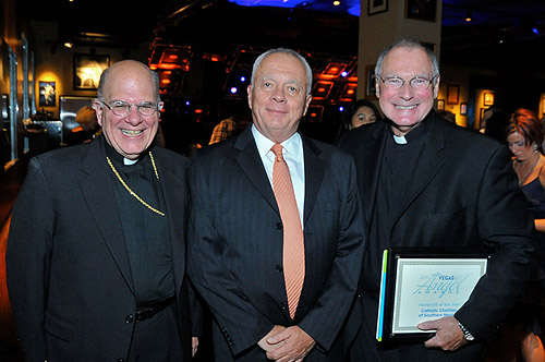Greenspun_Media_Group_Publisher_Bruce_Spotleson_with_representatives_from_Catholic_Charities_of_Southern_Nevada