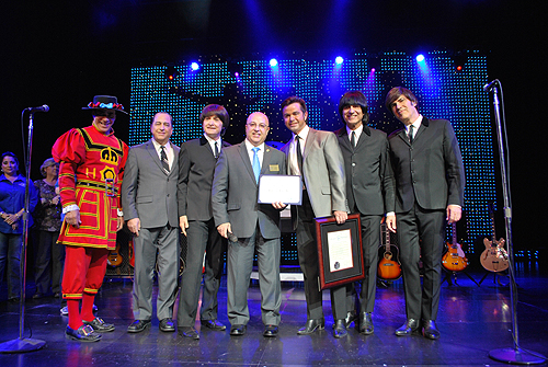 Keith Hughes from Congressman Joe Hecks office presents award to B-Beatleshow