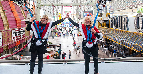 Dawn Newburg and Linda Smith celebrate their zip down SlotZilla 12.2.14 photo credit Tom Donoghue Photography