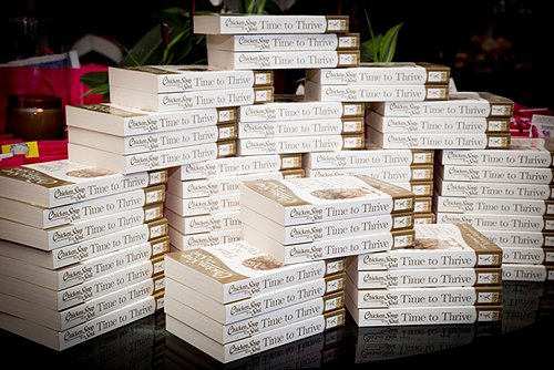 Copies of Chicken Soup for the Soul Time to Thrive at Book Launch Celebration Tonya Harvey