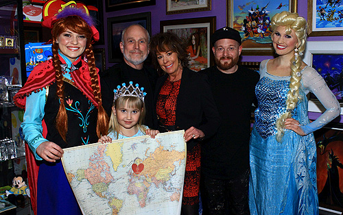 Ariez Black celebrates her wish reveal with Anna and Elsa from Frozen Neil Cantor managing director and Disney artists Paige OHara and Tennessee Loveless